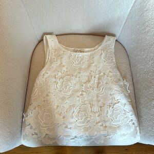 White blouse with embossed flower pattern